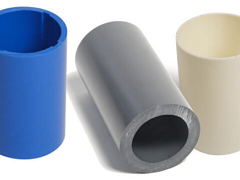 Heavy-wall extruded plastic tube in blue, grey and natural
