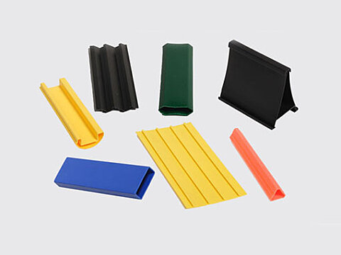 Custom extruded profiles in yellow, black, green, blue and orange