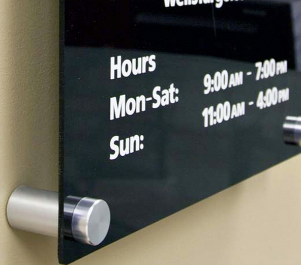 ADA exam room sign with Braille