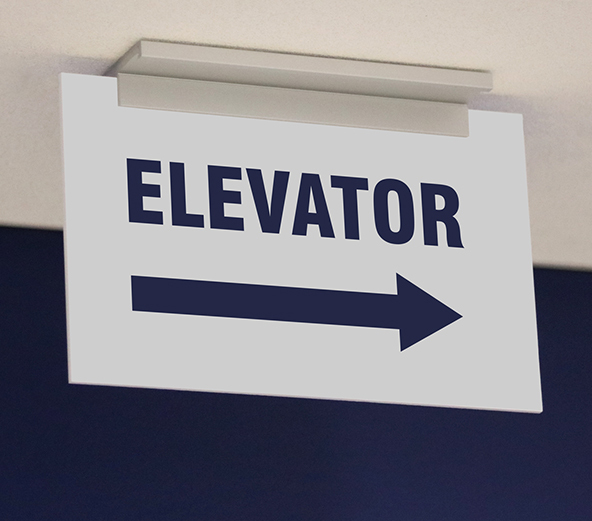 ADA exam room sign with Braille